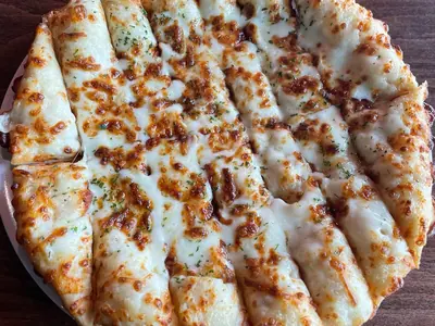 Cheesy bread sticks with melted, browned mozzarella at Durkin’s Pizza